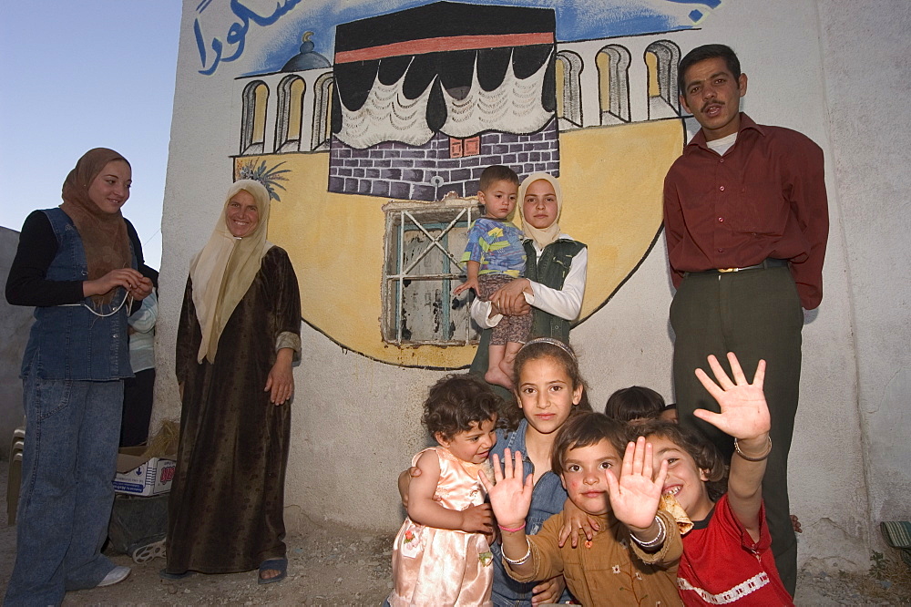 Local family with wall painting of Mecca, Apamea (Qalat at al-Mudiq), Syria, Middle East