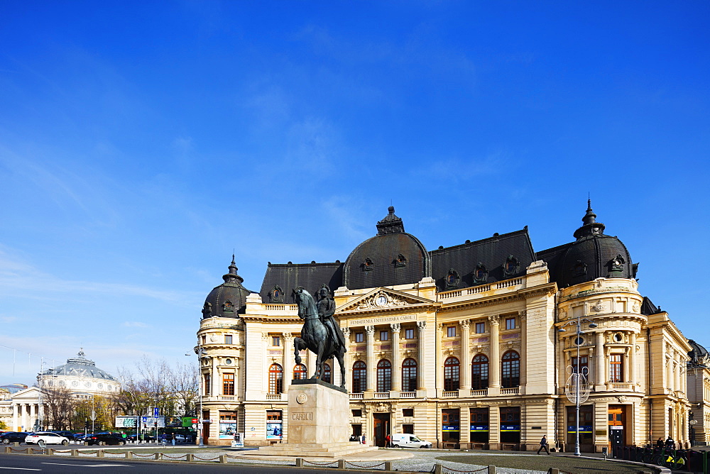 Central University library and statue of King Carol I of Romania, Bucharest, Romania, Europe