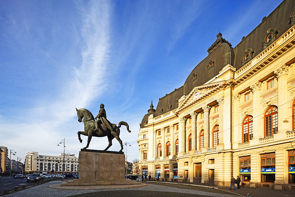 Central University library and statue of King Carol I of Romania, Bucharest, Romania, Europe