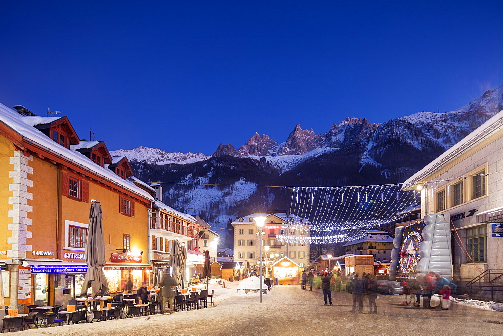 Christmas market decorations against backdrop of Mont Blanc mountain range, Chamonix, Haute Savoie, Rhone Alpes, France, Europe