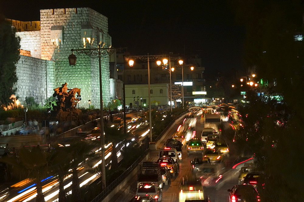 Car lights, walled city by night, Damascus, Syria, Middle East