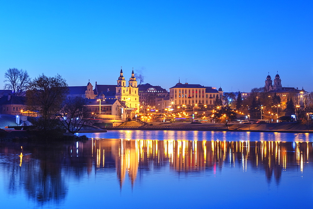 Trinity Suburb and Central Minsk reflecting in the Svislach river, Minsk, Belarus, Eastern Europe