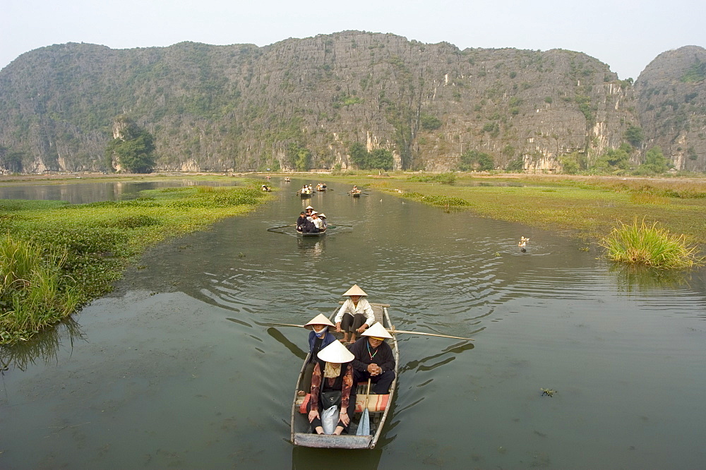 Boat on river, limestone mountain scenery, Tam Coc, Ninh Binh, south of Hanoi, North Vietnam, Southeast Asia, Asia