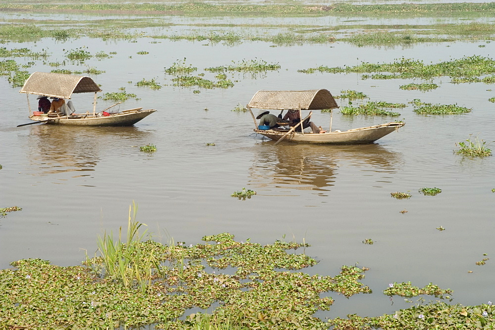 Boats on river delta river, Van Long, Ninh Binh, south of Hanoi, North Vietnam, Southeast Asia, Asia