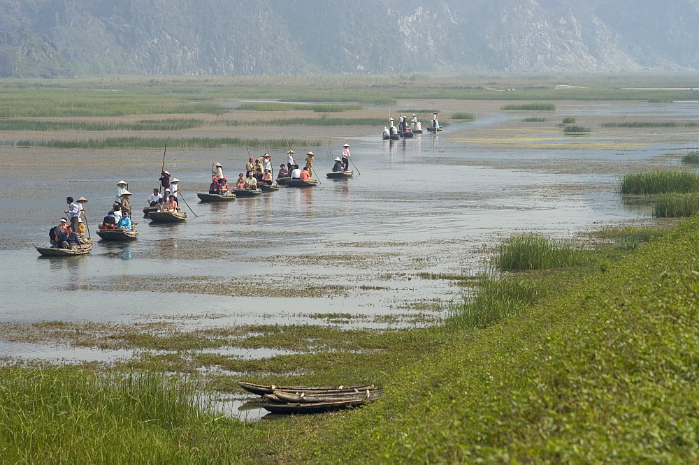 Punting boats on delta river, Van Long, Ninh Binh, south of Hanoi, North Vietnam, Southeast Asia, Asia