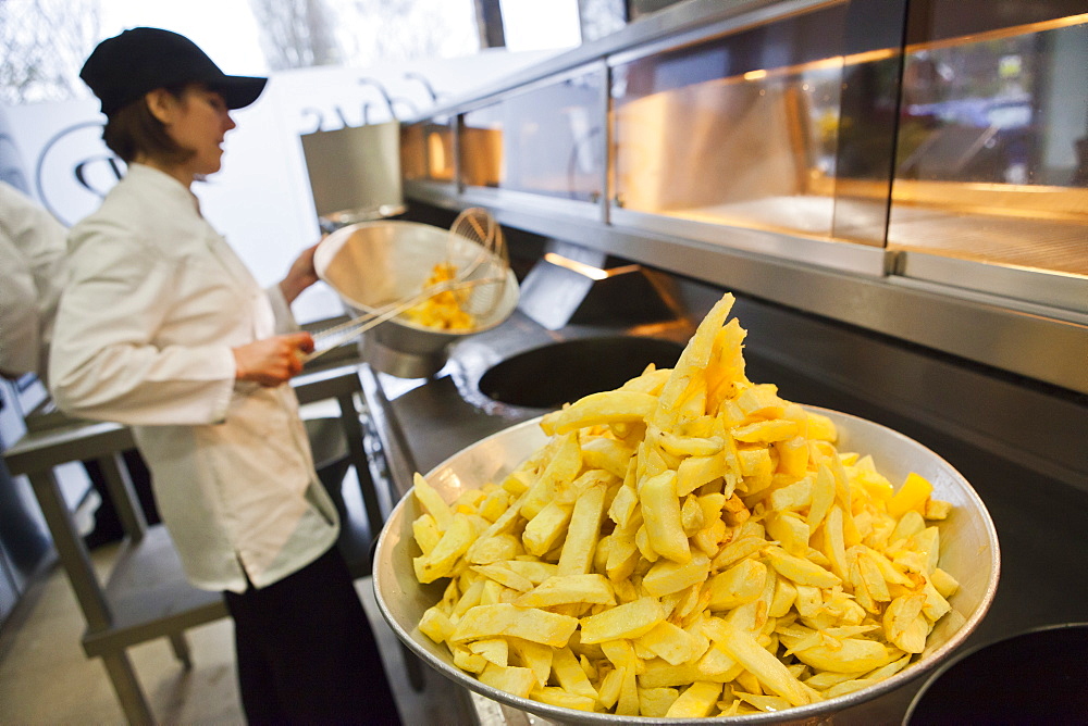 Chips being fried in traditional British chip shop, Gloucester, Gloucestershire, England, United Kingdom, Europe