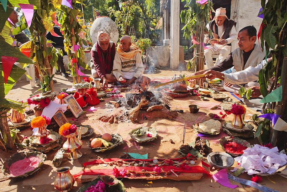 Priest with offerings at a rural Nepalese Hindu marriage ceremony, Pokhara, Nepal, Asia