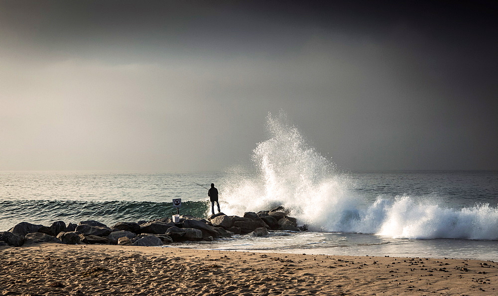 Early morning fisherman on Will Rogers Beach, Pacific Palisades, California, United States of America, North America