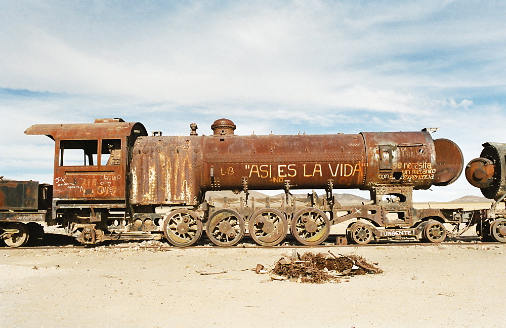 Rusting locomotive at train graveyard, Uyuni, Bolivia, South America