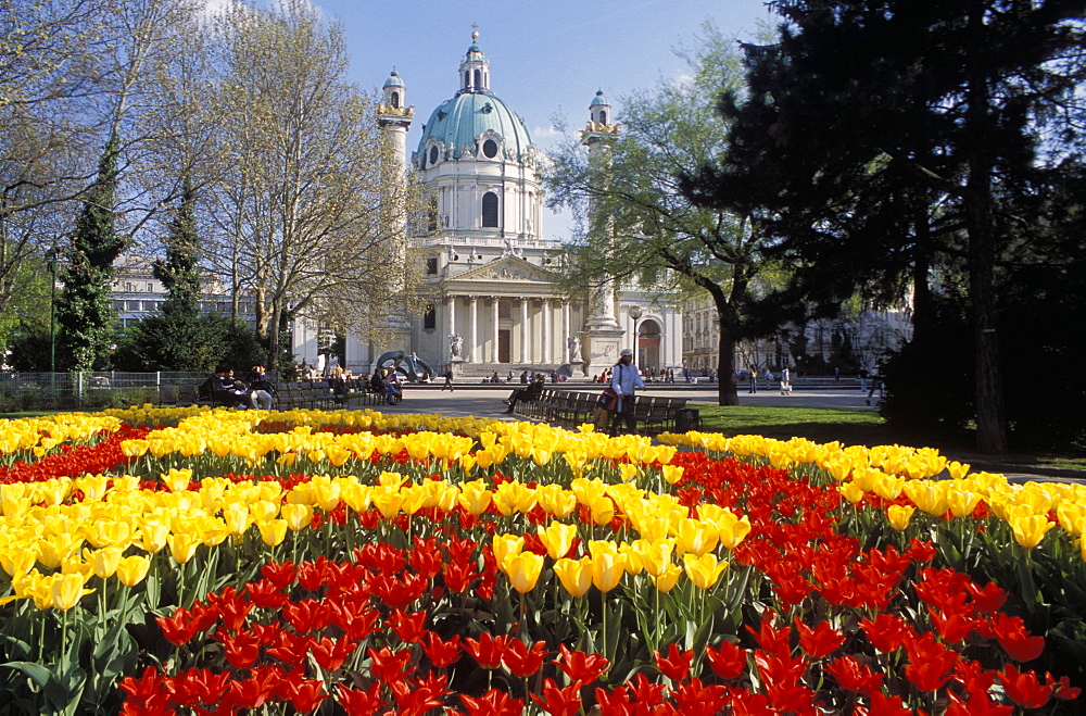 View over flowerbeds of red and yellow tulips to the Karlskirche (church), at Karlsplatz, Innere Stadt, Vienna, Austria, Europe