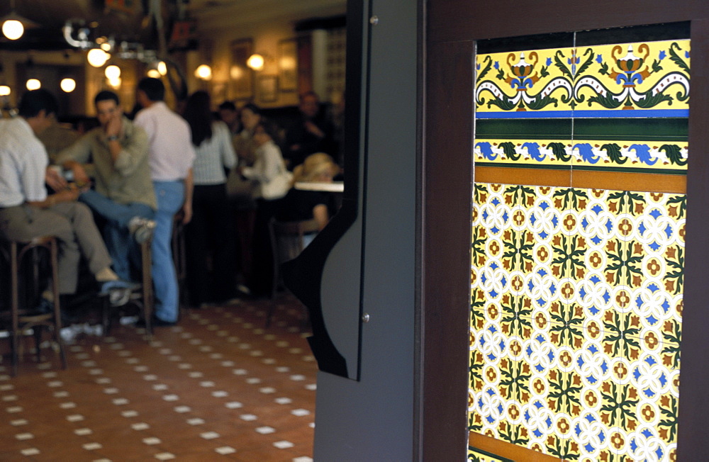 People inside a tapas bar and a detail of decorative tiled wall, Calle Maestro, Centro, Madrid, Spain, Europe