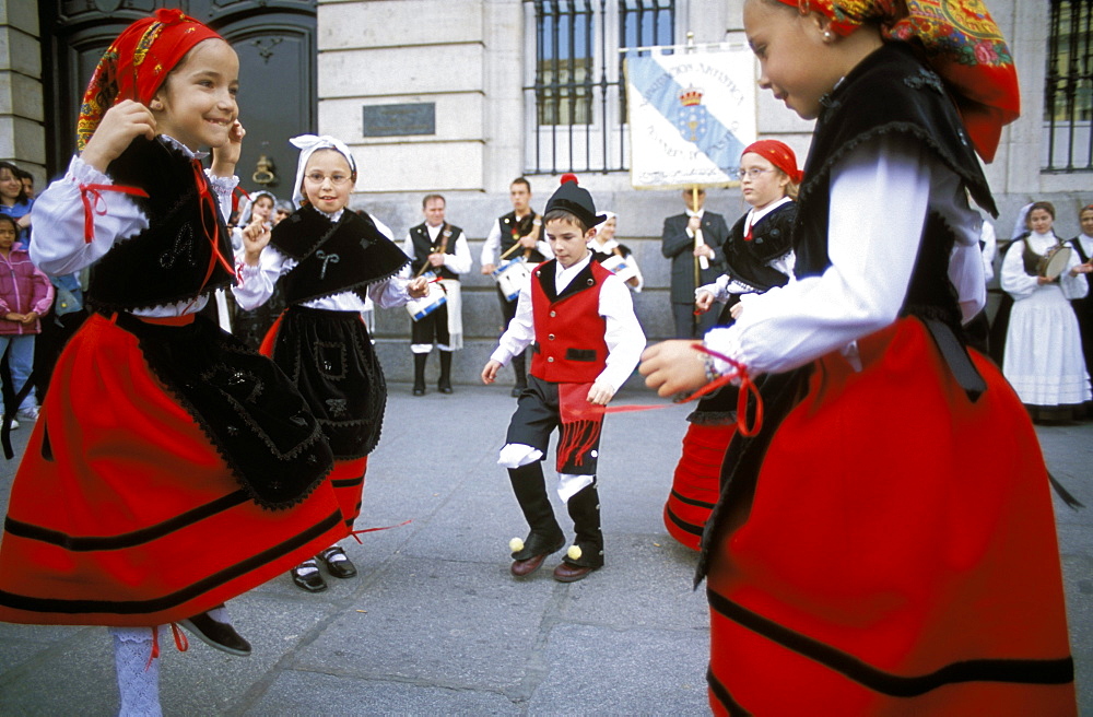 Spanish children in national dress performing outdoors at Plaza de la Puerto del Sol, Centro, Madrid, Spain, Europe