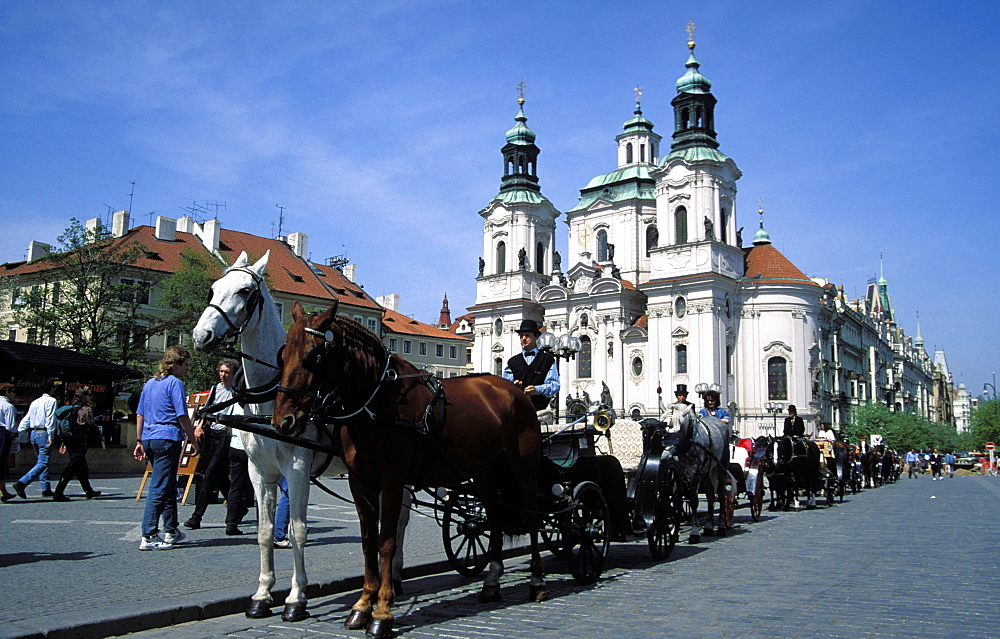 Horse drawn carriage at Old Town Square and St. Nicholas church, Stare Mesto, Prague, Czech Republic, Europe