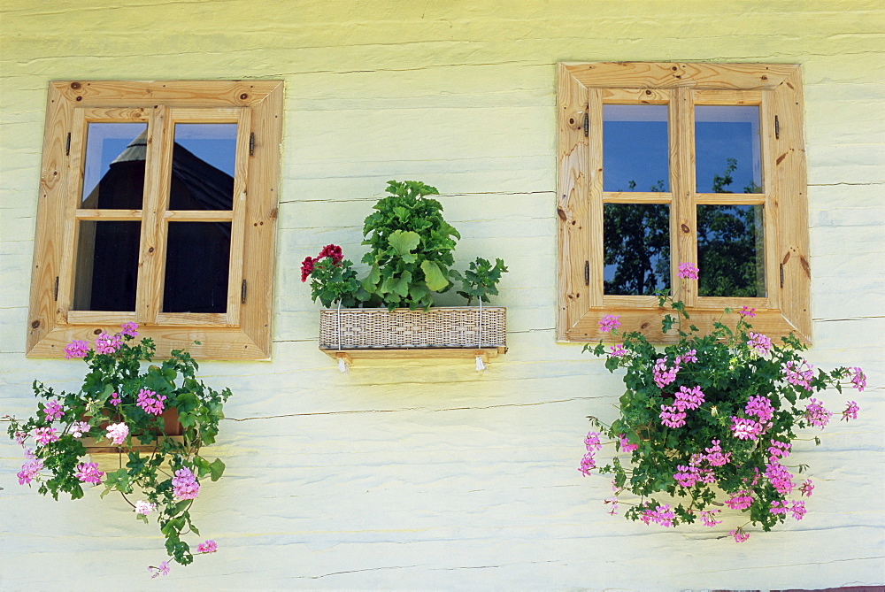 Windows of one of unique village architecture houses in Vlkolinec village, UNESCO World Heritage Site, Velka Fatra mountains, Slovakia, Europe