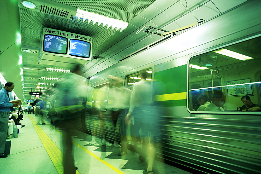 Passengers boarding train at Parliament Station in the City of Melbourne, Melbourne, Victoria, Australia, Pacific