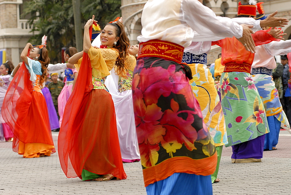 Malay female dancers wearing traditional dress at celebrations of Kuala Lumpur City Day Commemoration, Merdeka Square, Kuala Lumpur, Malaysia, Southeast Asia, Asia