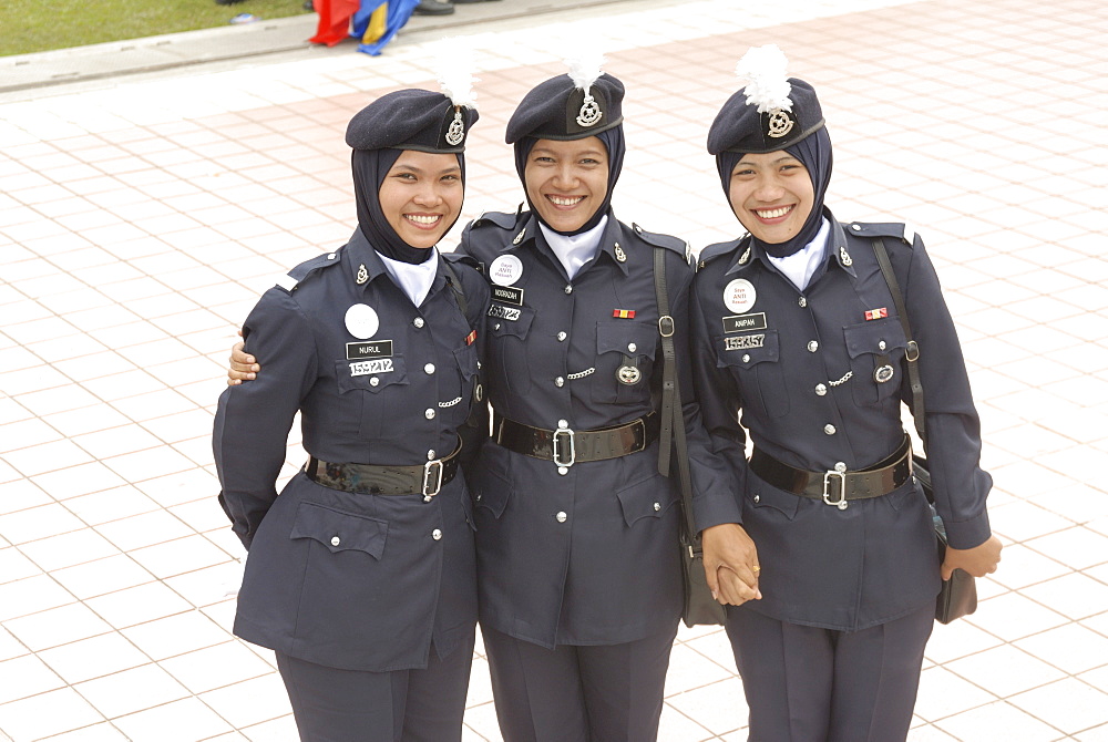 Three female police force members at celebrations of Kuala Lumpur City Day Commemoration, Merdeka Square, Kuala Lumpur, Malaysia, Southeast Asia, Asia