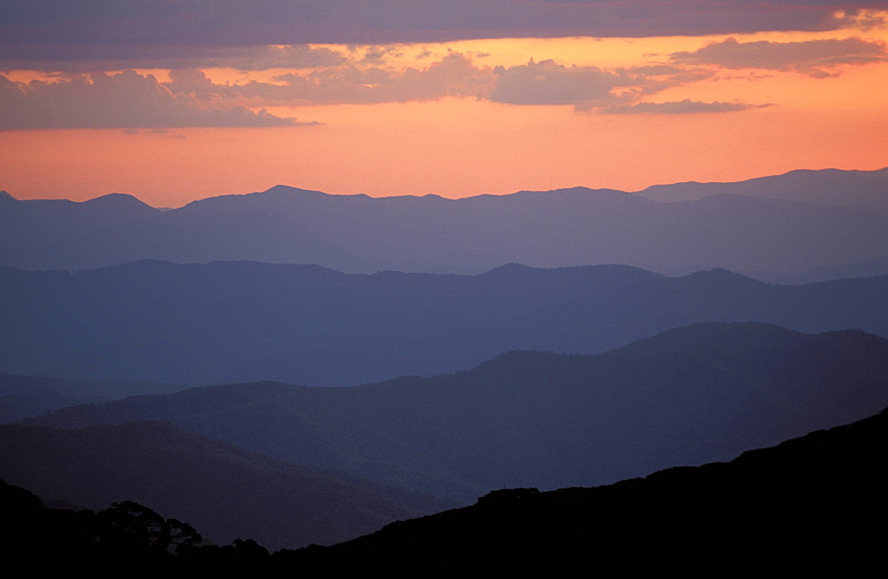 Landscape view, twilight glow and mountain ridges of High Country from Mount Feathertop, Alpine National Park, High Country, Victoria, Australia, Pacific