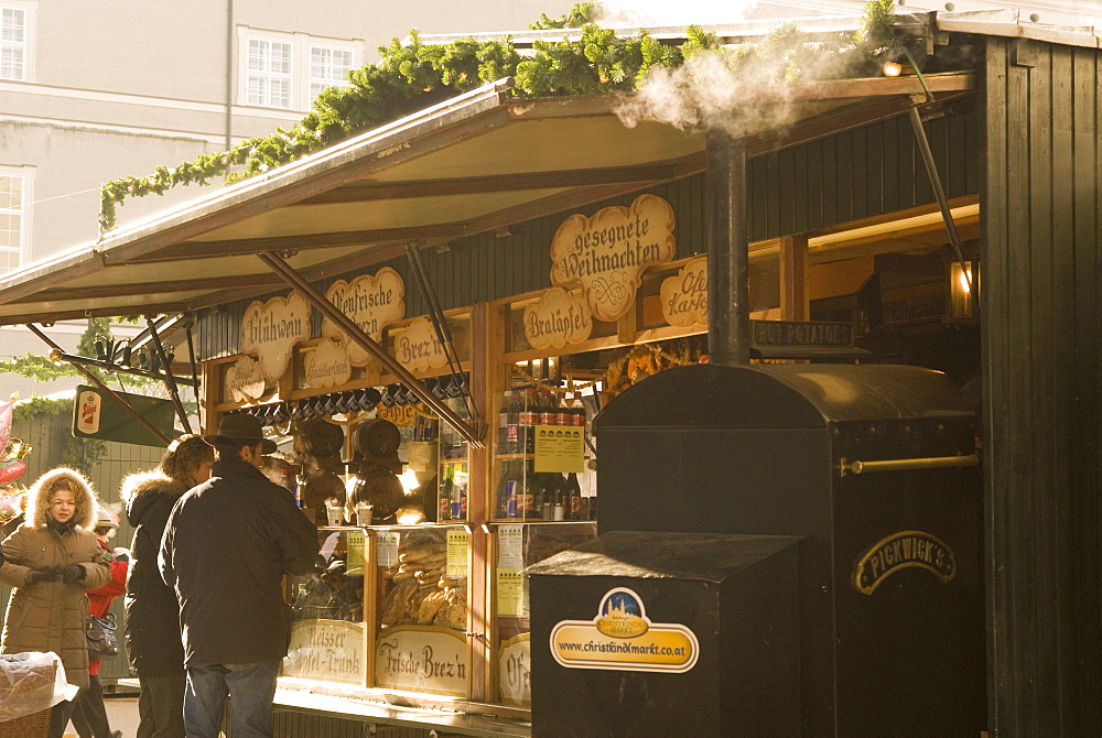 Sausage, hot wine, hot potato and snack stand at Historical Salzburg Christkindlmarkt (Christmas market), Domplatz, Salzburg, Austria, Europe