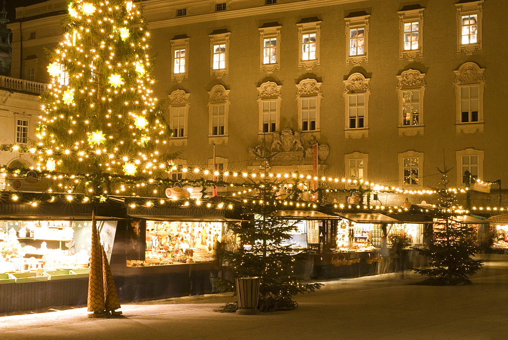 Historical Salzburg Christkindlmarkt (Christmas market) with stalls and Rezidens building at night, Residenzplatz, Salzburg, Austria, Europe