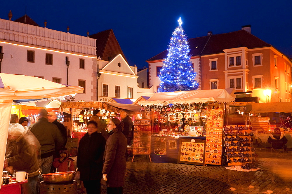 Christmas Market stalls and Christmas tree at twilight, Svornosti Square, Cesky Krumlov, Ceskobudejovicko, Czech Republic, Europe