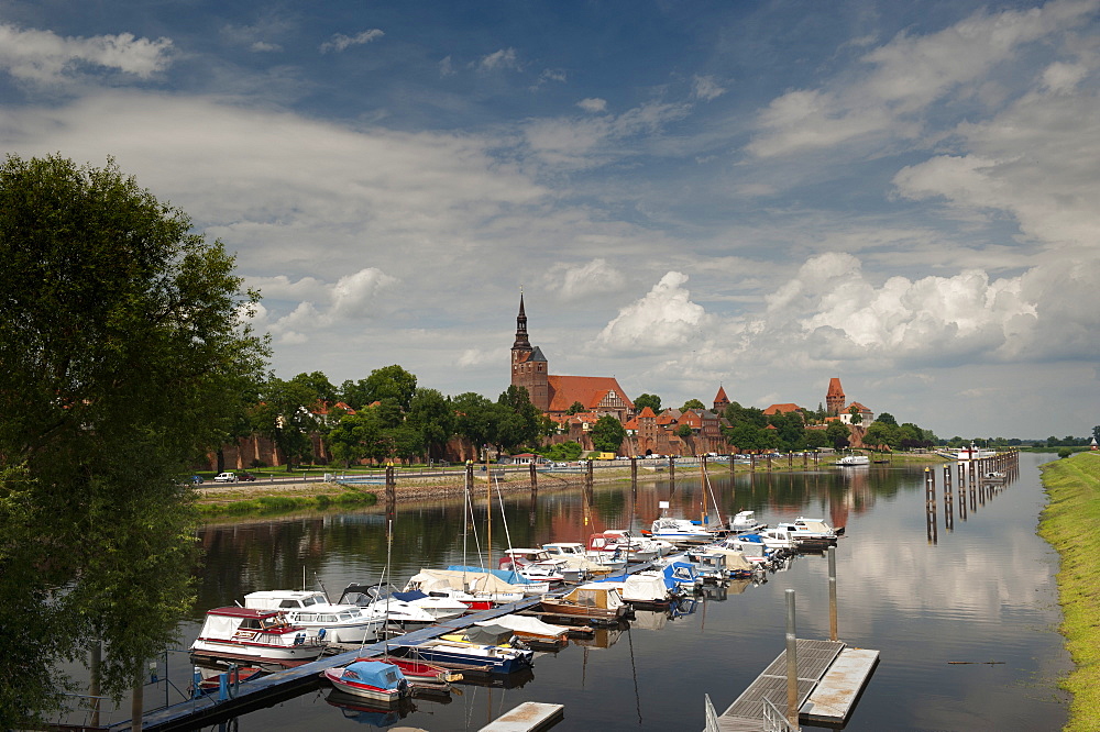 Boat harbour on the Elbe River below walls of historical town of Tangermunde, Saxony-Anhalt, Germany, Europe