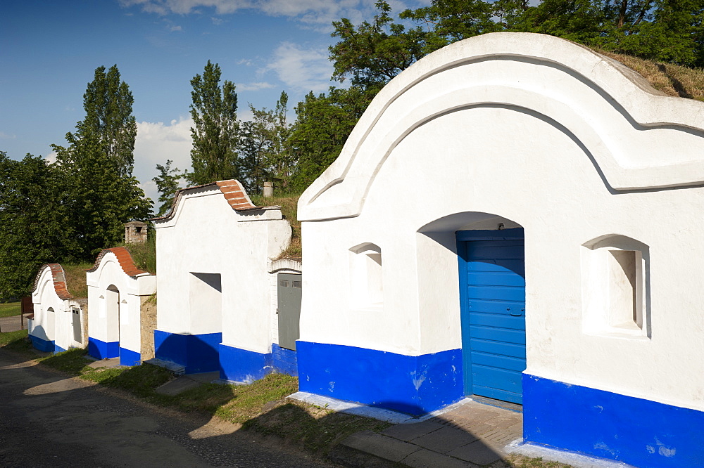 Wine cellars (plze) with facades painted in Moravian Slovacko folk style at wine cellar lane, Petrov, Brnensko, Czech Republic, Europe