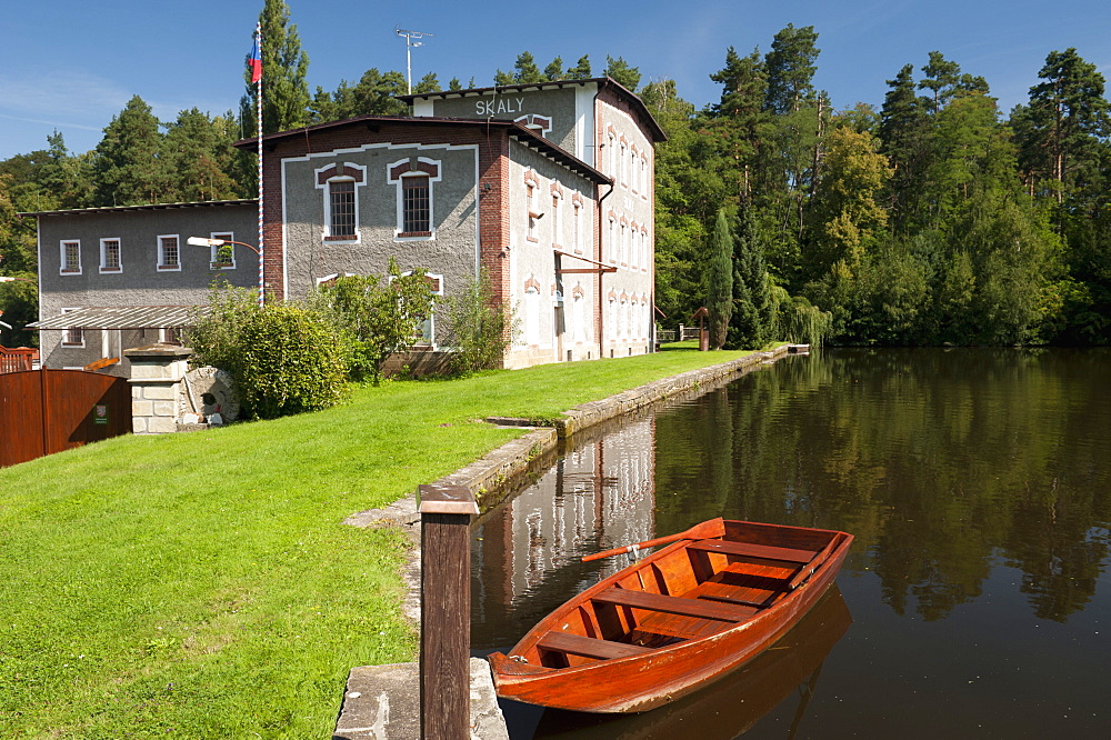 Skaly Mill with pond and boat, Slatinany, Pardubicko, Czech Republic, Europe