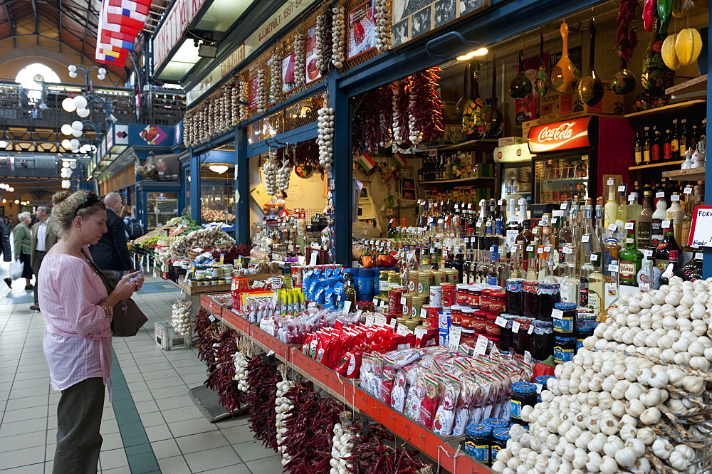 Woman shopping inside Nagycsarnok Market, Budapest, Hungary, Europe