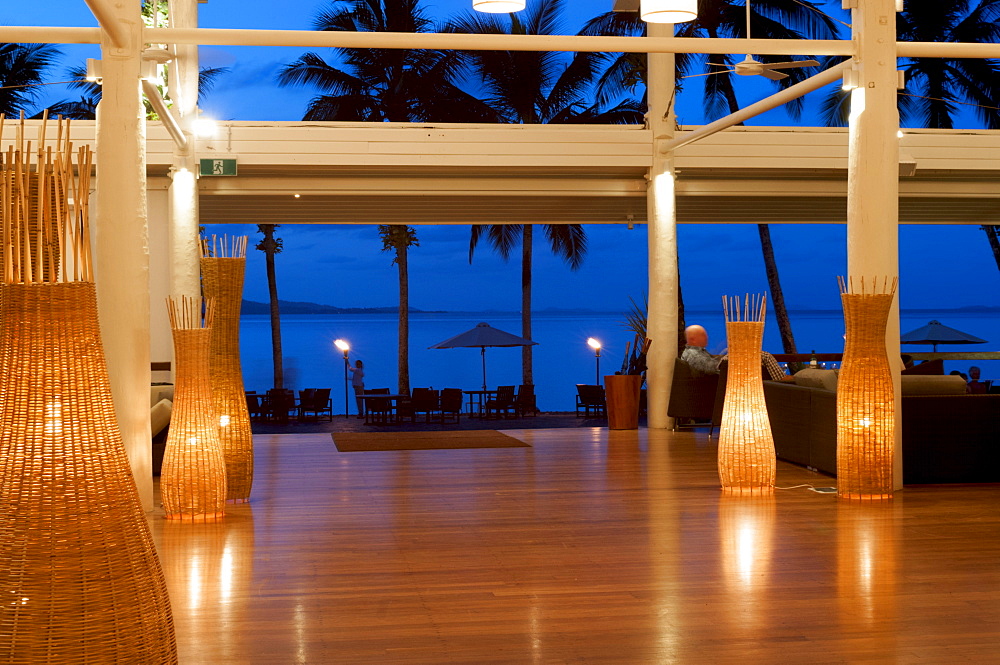 Looking out from lounge of Dunk Island Resort into Pacific Ocean, Great Barrier Reef, at twilight, Mission Beach, Queensland, Australia, Pacific