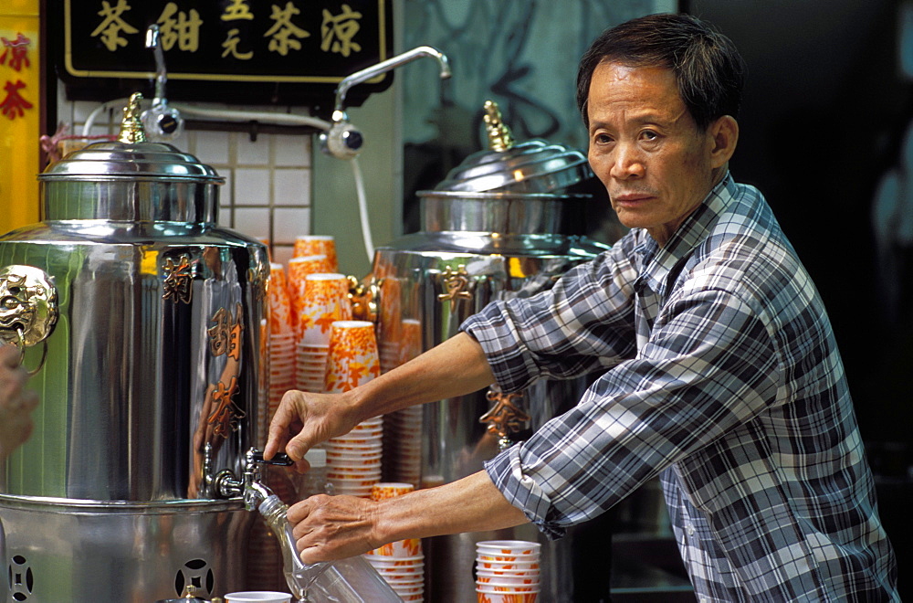 Portrait of a Chinese man selling herbal tea, Stanley Street, Soho, Hong Kong, China, Asia