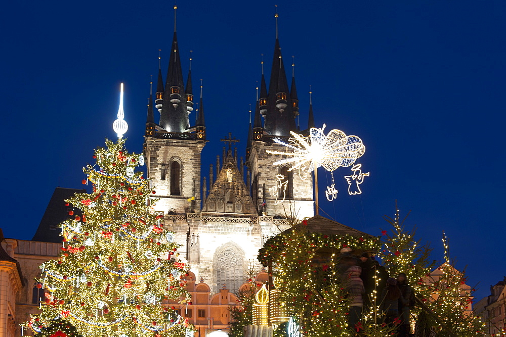 Christmas Tree and decorations in front of Tyn Gothic Church, Old Town Square, UNESCO World Heritage Site, Prague, Czech Republic, Europe 