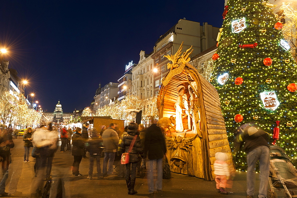 Christmas Market and Christmas tree, Nativity Scene and National Museum at Wenceslas Square during Advent evening, Nove Mesto, Prague, Czech  Republic, Europe