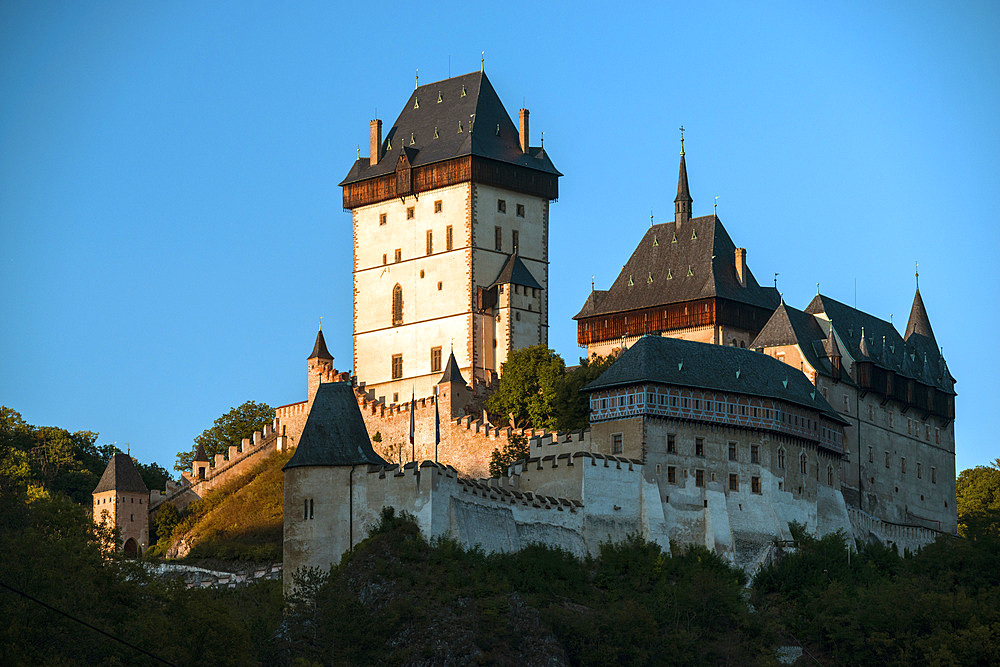 The Gothic 14th century Karlstejn Castle at sunset, Karlstejn, Central Bohemia, Czechia, Europe