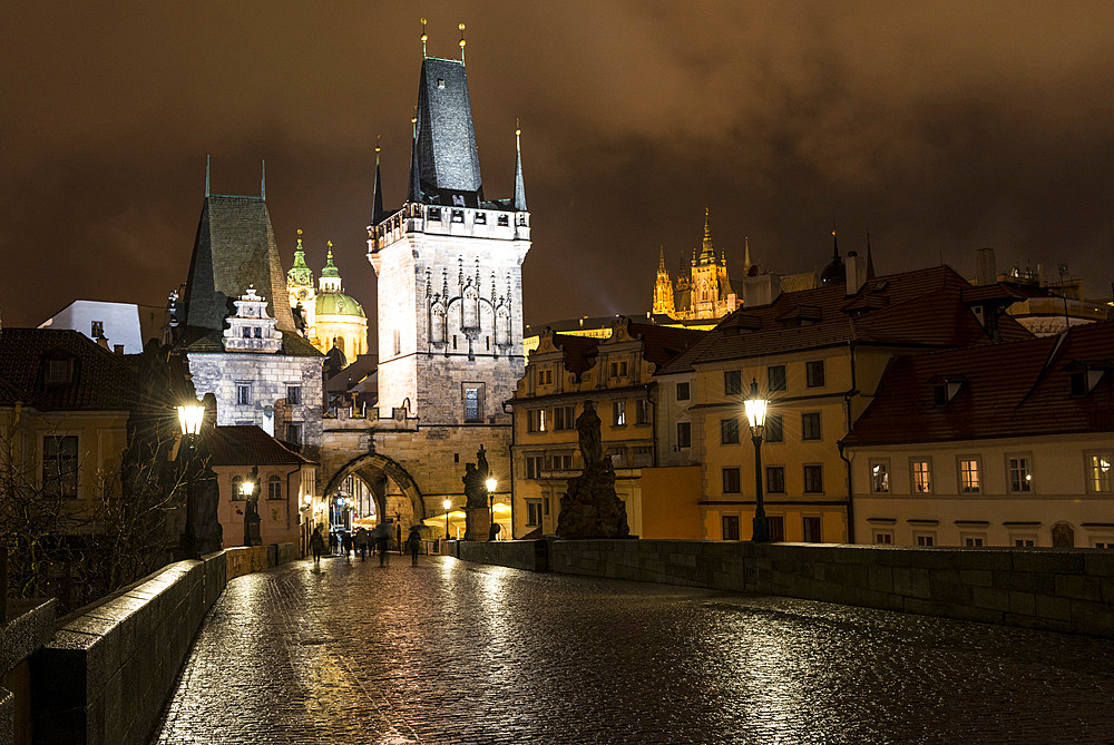 Gothic Malostranska Charles Bridge Towers, St. Nicholas Church and St. Vitus Cathedral from rainwetted Charles Bridge, Lesser Town (Mala Strana), UNESCO World Heritage Site, Prague, Czechia, Europe