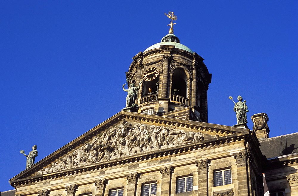 Detail of the decoration of the upper part and clock tower of the Royal Palace, Amsterdam, The Netherlands (Holland), Europe