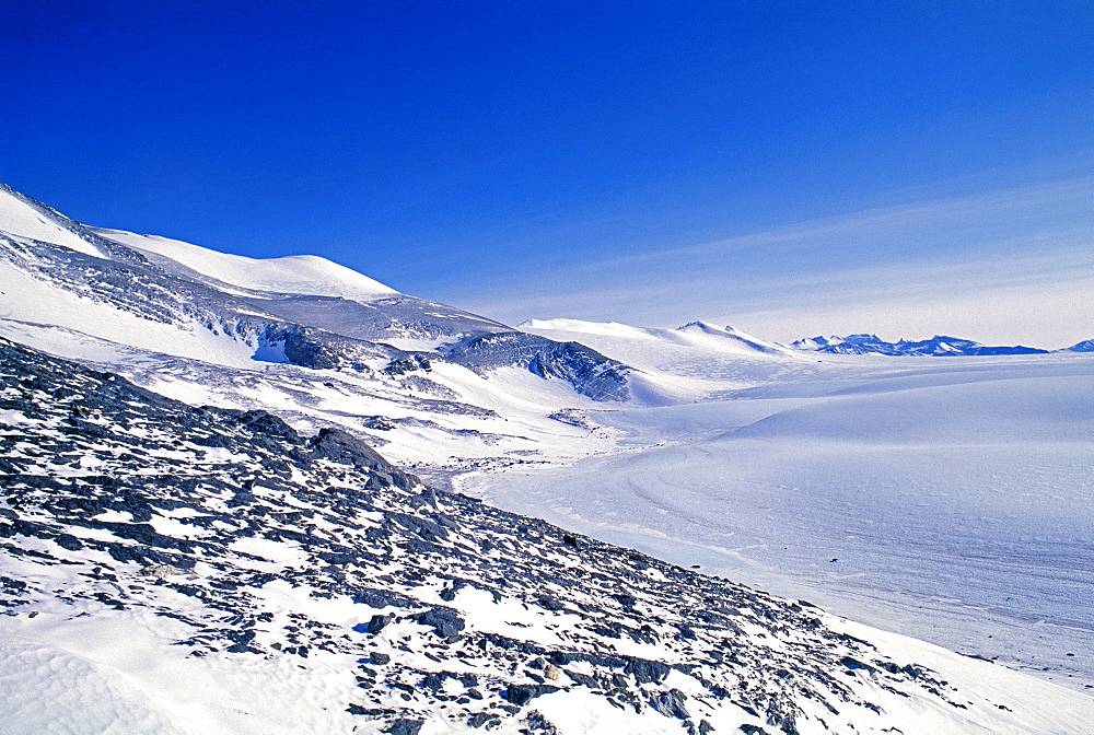 Blue ice bordering the mountain range, Ellsworth Mountains at Patriot Hills, Antarctica, Polar Regions