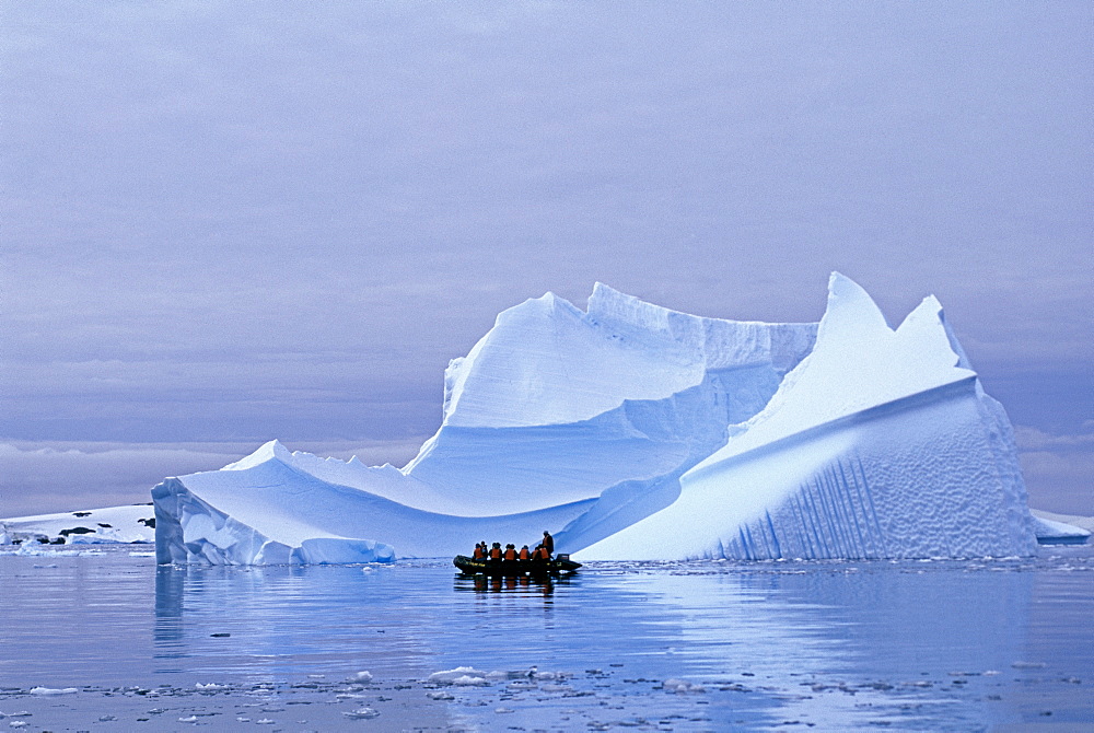 Tourists on Zodiac cruise around icebergs on the Antarctic Peninsula, Antarctica, Polar Regions