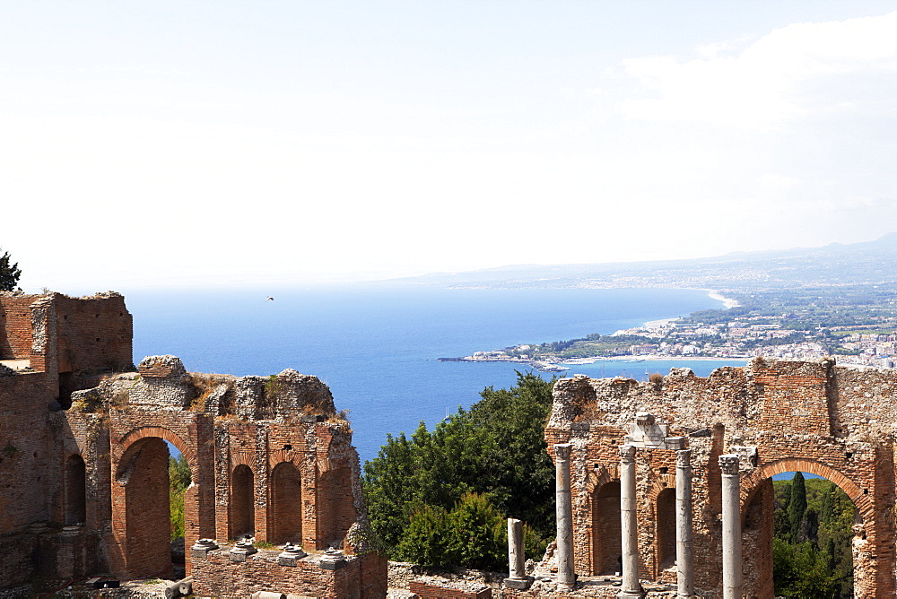 View over the Naxos coast from the Greek Roman theatre of Taormina, Sicily, Italy, Europe