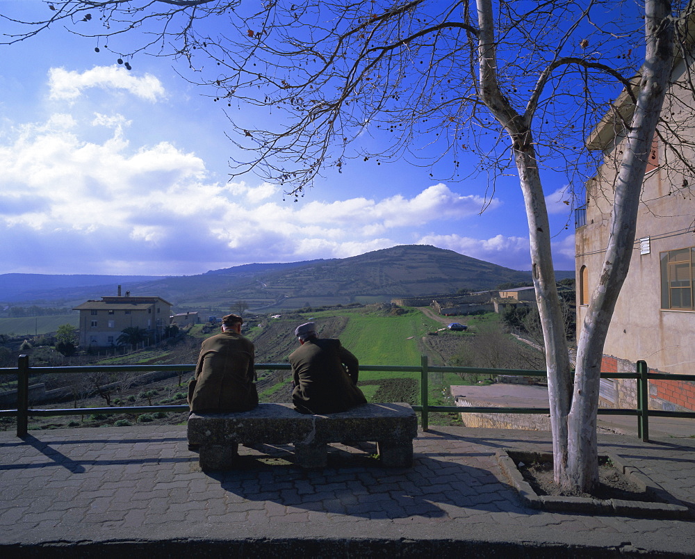 Two men on a bench, Barbagia, Sardinia, Italy, Europe