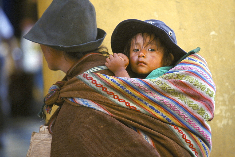 Carrying baby, Cuzco, Peru, South America