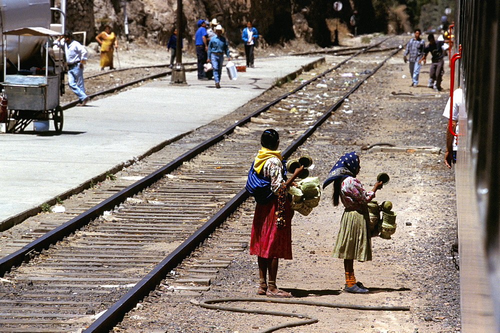 Tarahumara selling goods to passengers on a train, Mexico, North America