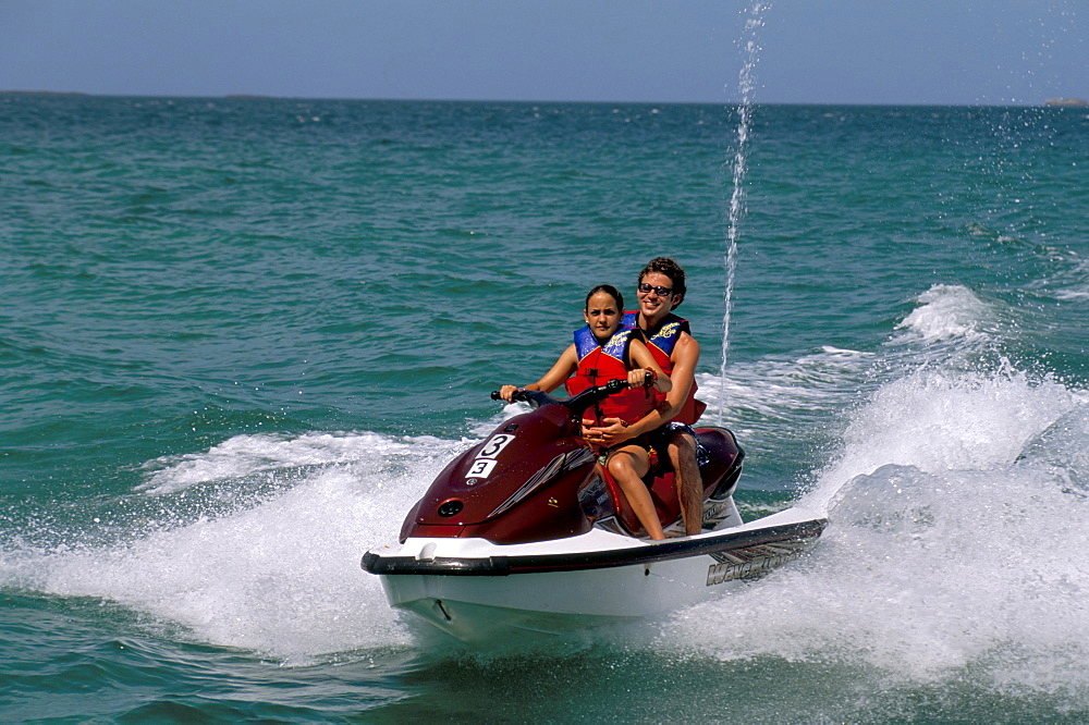 Couple on a jet-ski, Contadora island, Las Perlas archipelago, Panama, Central America