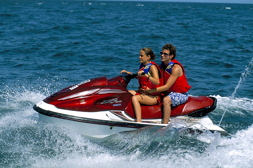 Couple on a jet-ski, Contadora island, Las Perlas archipelago, Panama, Central America