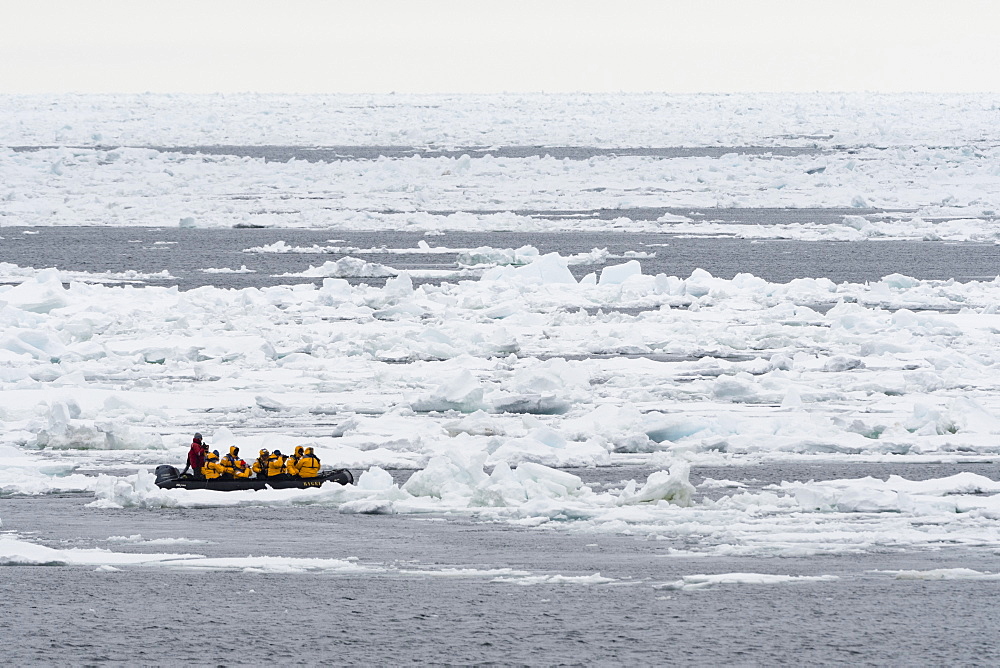 Tourists on inflatable boats exploring the Polar Ice Cap, 81 degrees, north of Spitsbergen, Svalbard, Arctic, Norway, Europe