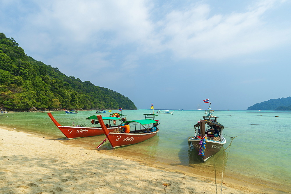 Three long tailed boats on a sandy beach, Thailand, Southeast Asia, Asia