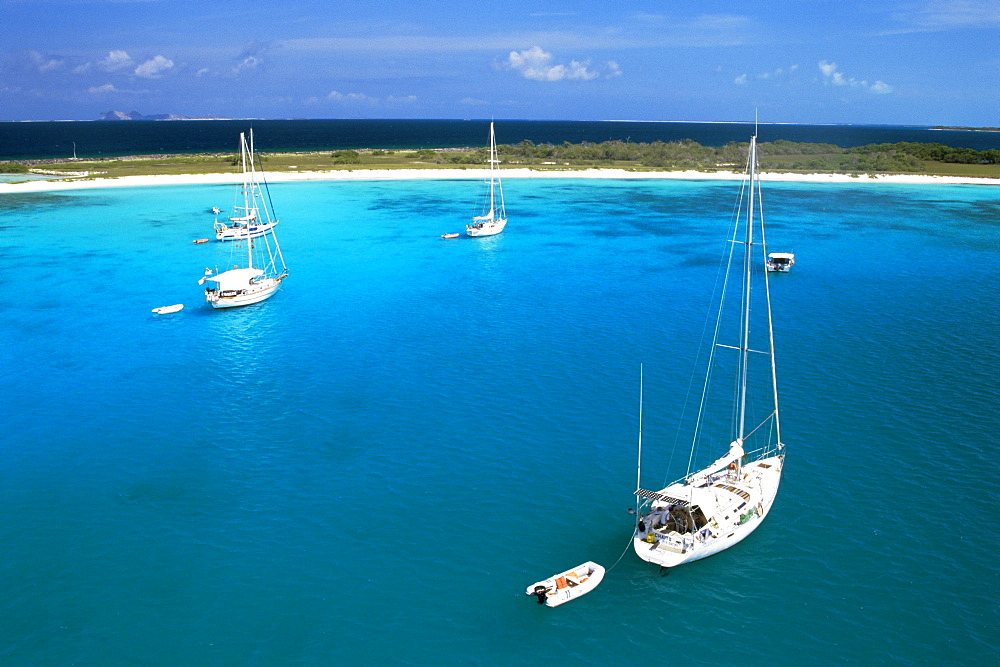 Chaito, sailing boat of the floating village in the foreground, Crasqui, Los Roques, Venezuela, South America