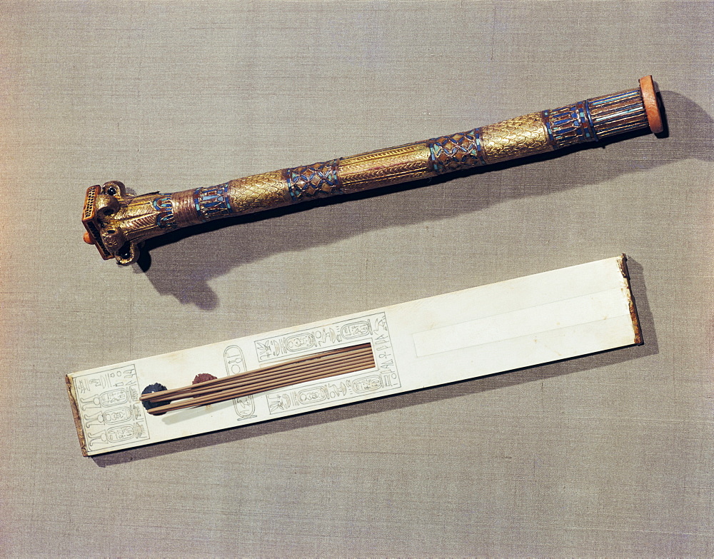 A scribe's palette in ivory and a case for writing-reeds made of wood plated with gold and inlaid with glass-paste, from the tomb of the pharaoh Tutankhamun, discovered in the Valley of the Kings, Thebes, Egypt, North Africa, Africa