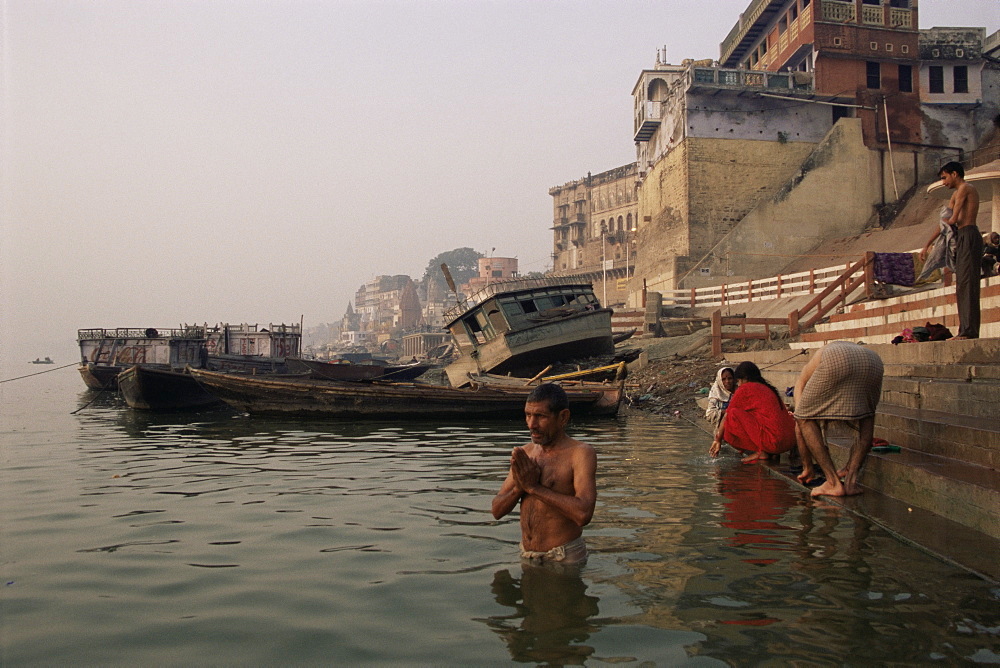 Morning ablutions, Hindu pilgrims bathing in the River Ganges (Ganga), Varanasi (Benares), Uttar Pradesh state, India, Asia