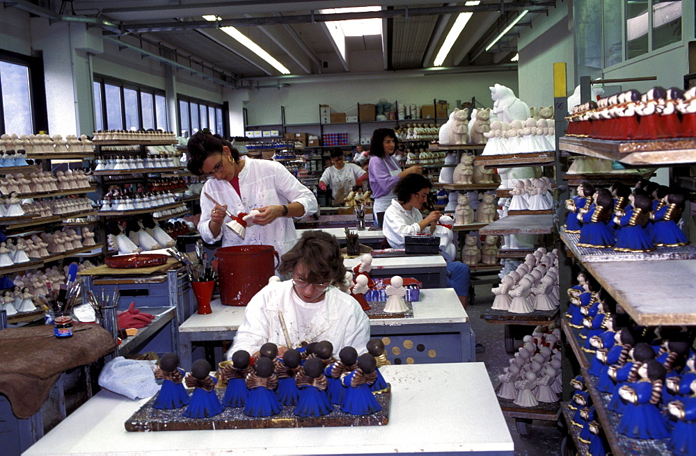 Decoration of pottery angels, Thun factory, Bolzano, Trentino Alto Adige, Italy.